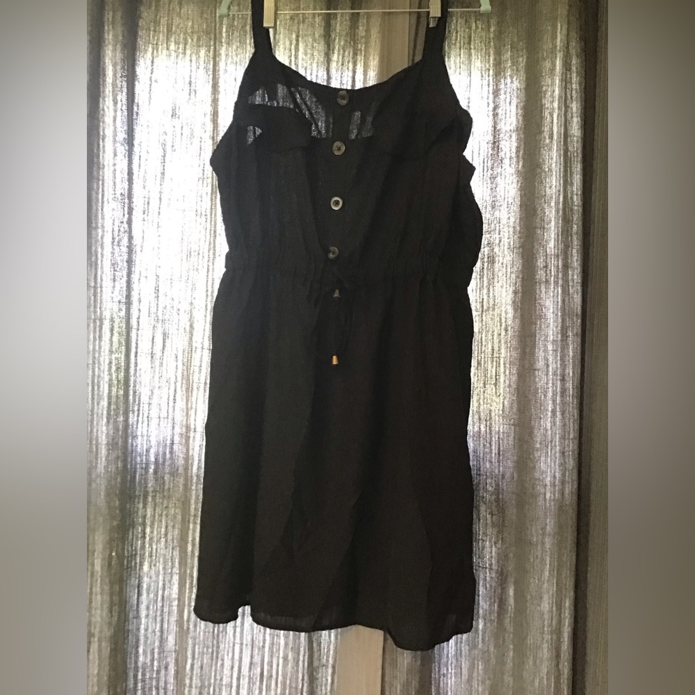 Black tank dress with buttons and waist tie.